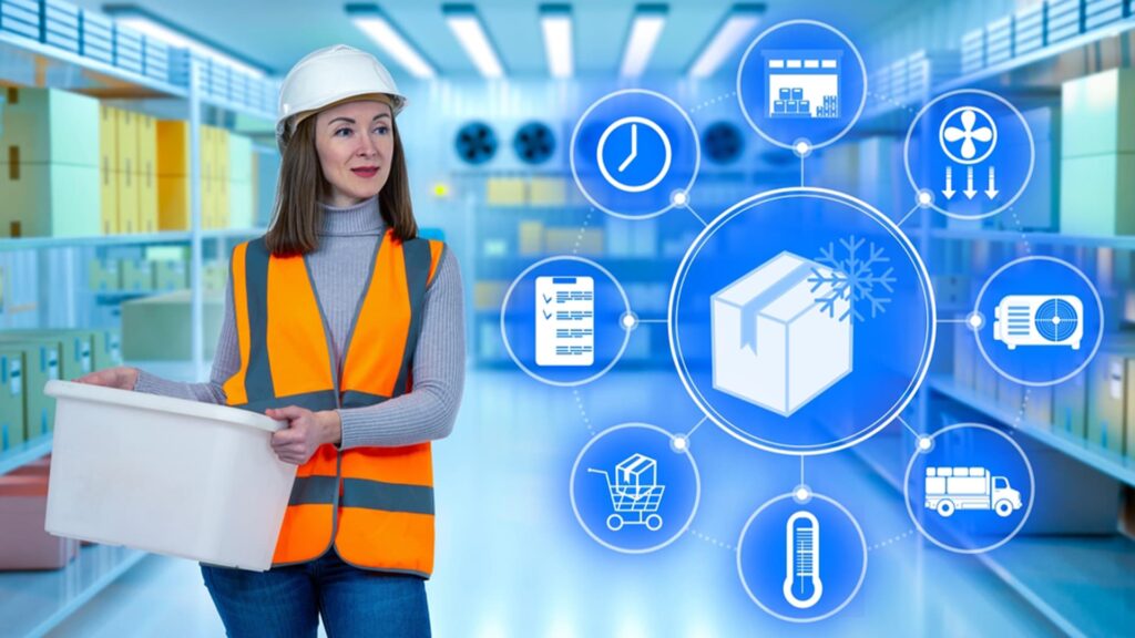 Female worker in a cold storage facility holding a container, with digital icons representing the food cold chain process